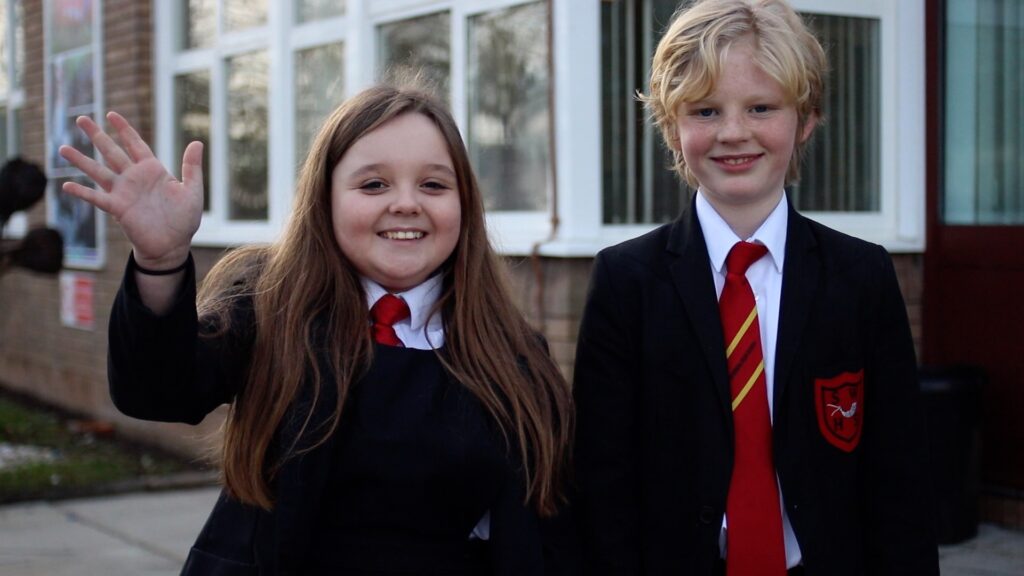 south wirral high school students outside the school