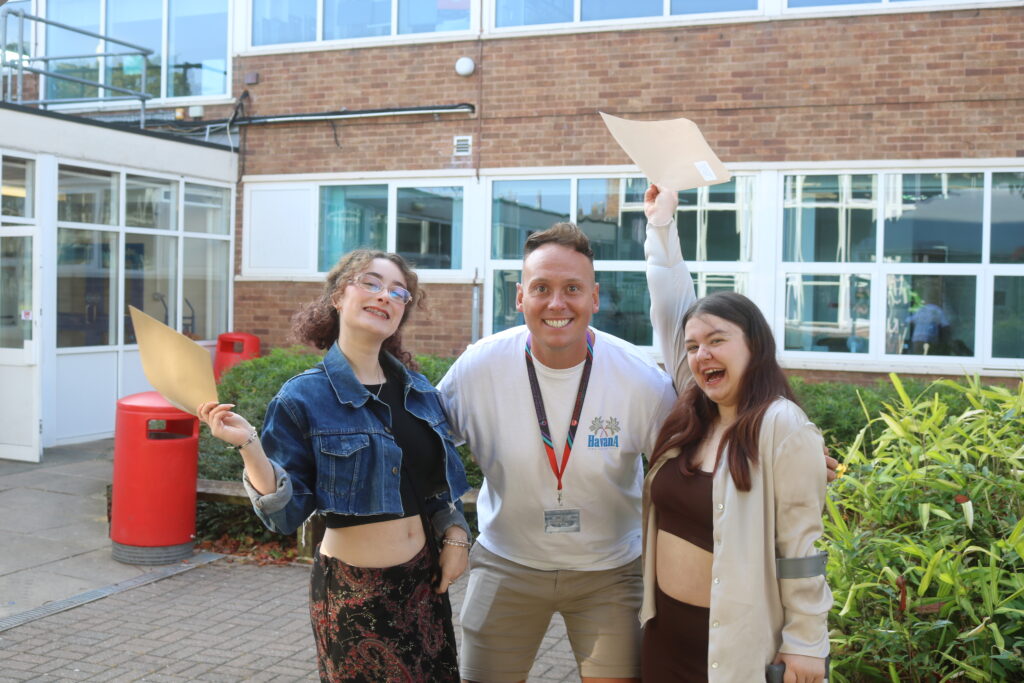 students with teacher outside in the quad