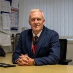 Mr Cloherty in his office at South Wirral High school