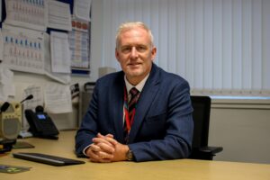 Mr Cloherty in his office at South Wirral High school