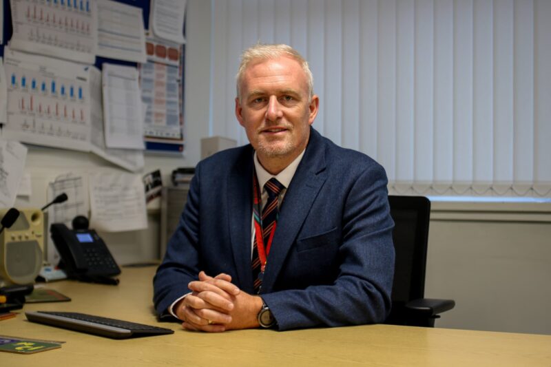 Mr Cloherty in his office at South Wirral High school