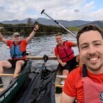 South Wirral high school staff in a canoe taking part in the race the sun challenge for charity