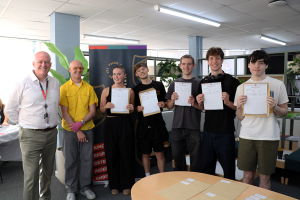Photo of students with headteacher on A Level Results Day