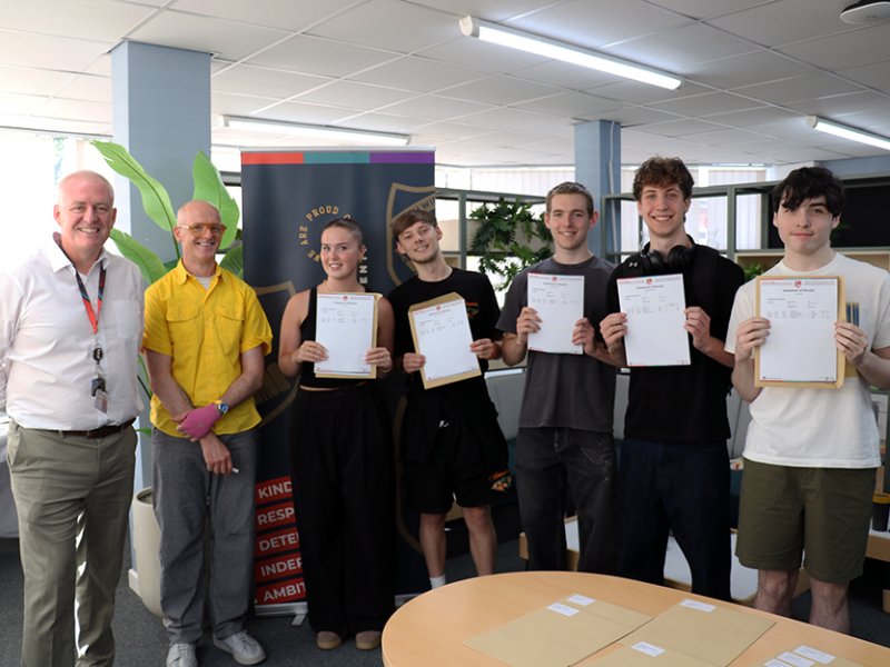 Photo of students with headteacher on A Level Results Day